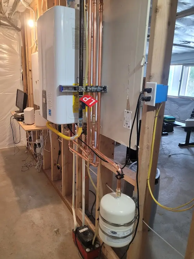 Licensed plumber repairing a kitchen sink in Dover